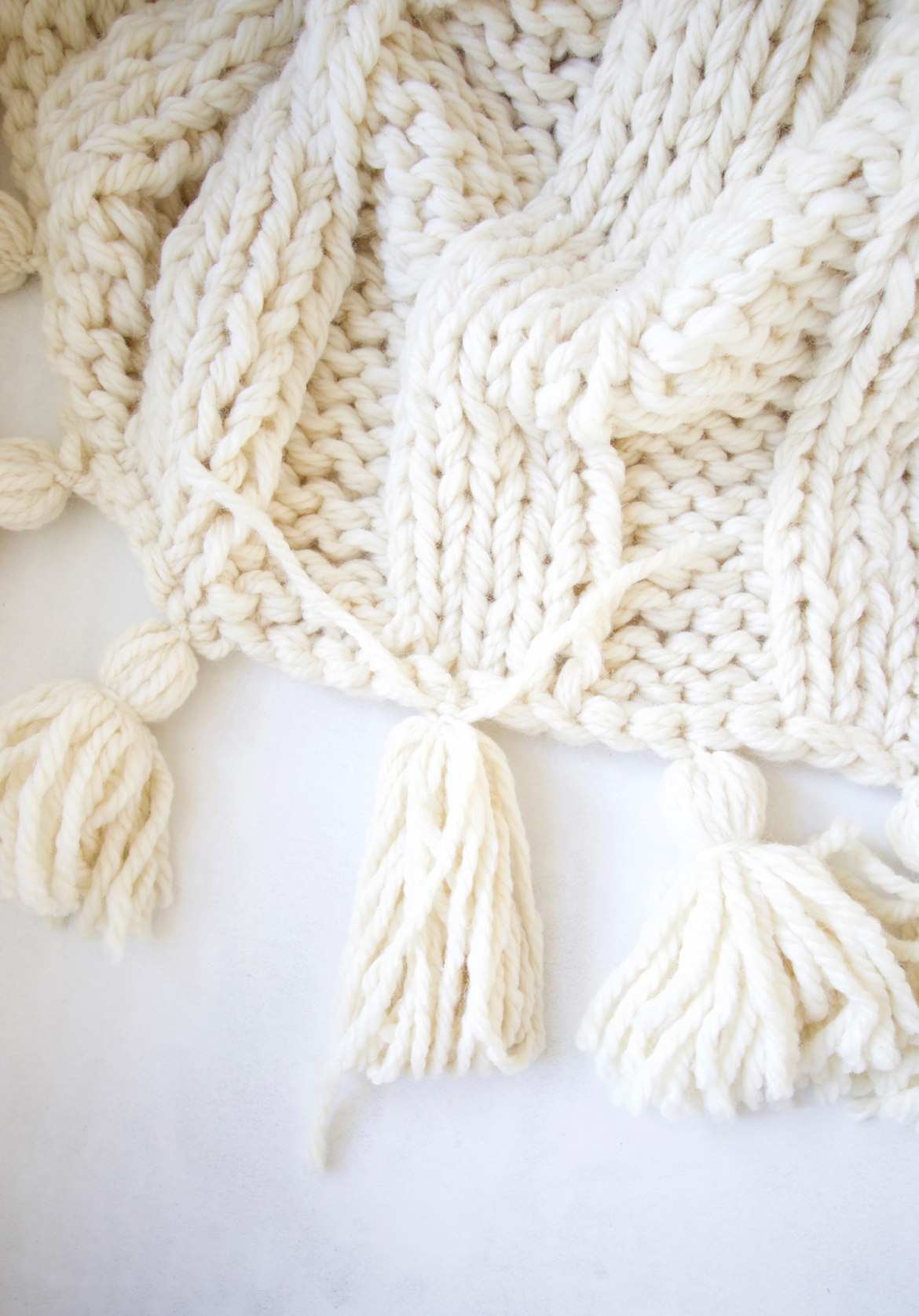 Step by Step Tassel Tutorial : How to make tassels for your chunky wool blanket.  These knit tassels will work for any blanket, knit blanket, or throw blanket. Easy to follow directions on DESIGN THE LIFE YOU WANT TO LIVE | LynneKnowlton.com